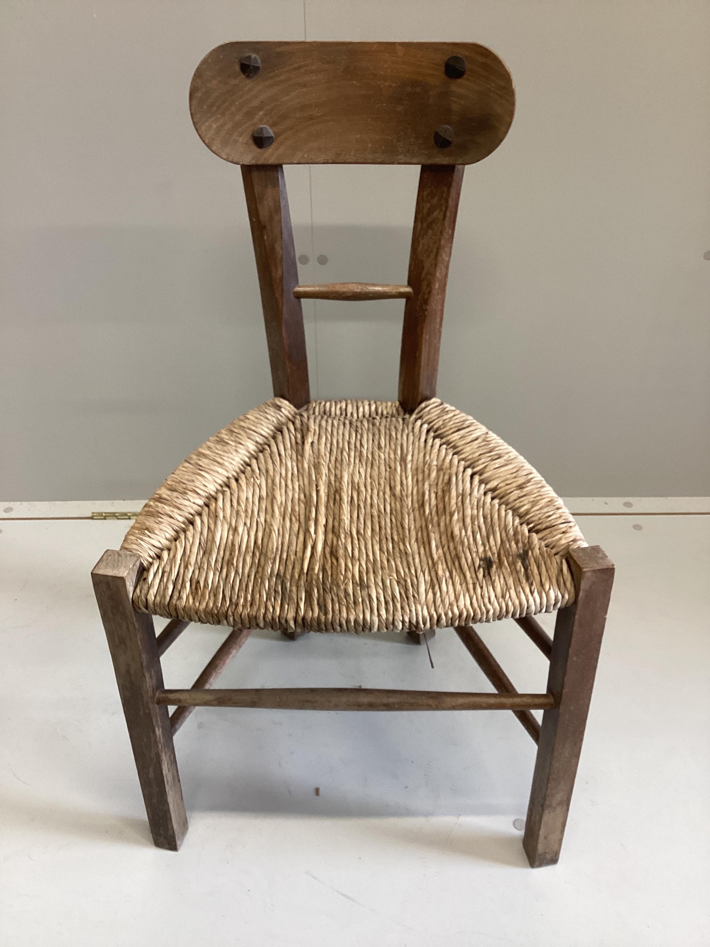 An Arts and Crafts style rush seat hardwood side chair, width 46cm, height 80cm